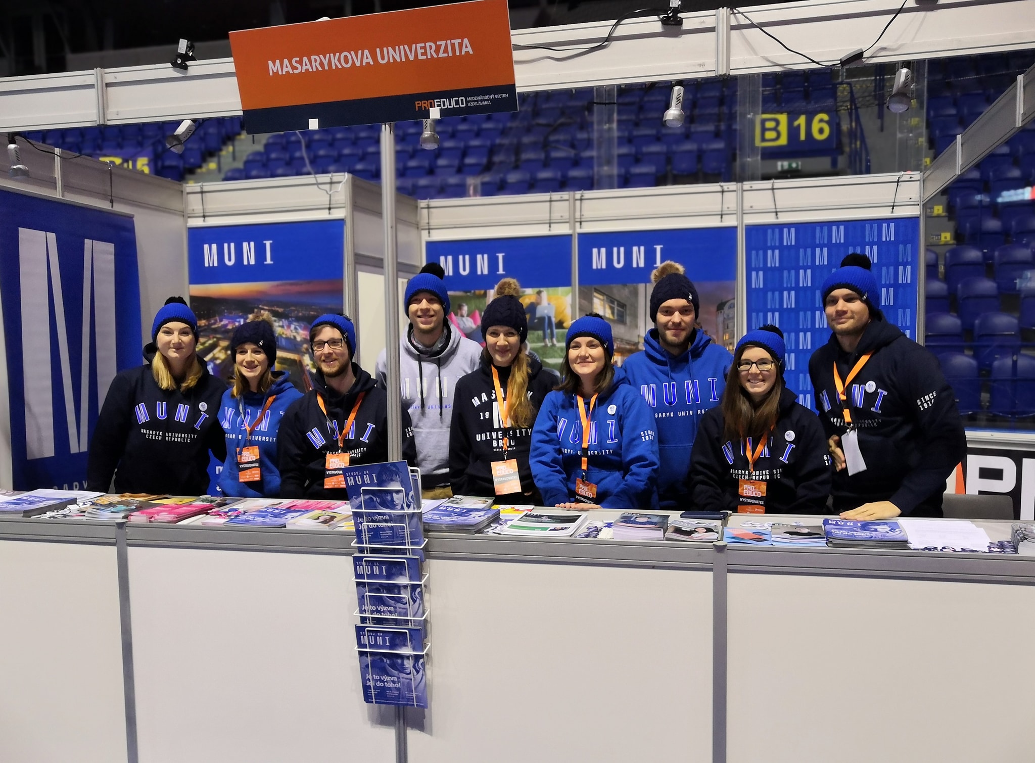 picture of girls helping with university event sitting at the welcome desk